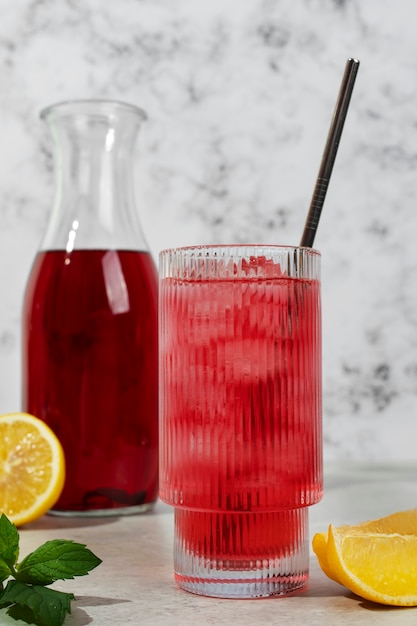 Free Photo refreshing hibiscus ice tea in clear glass container