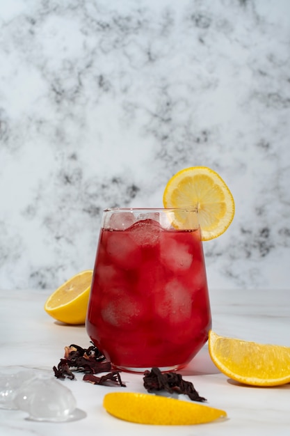 Free Photo refreshing hibiscus ice tea in clear glass container