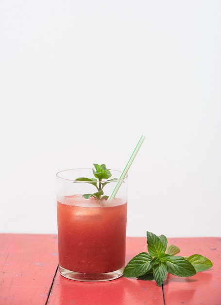 Free photo refreshing red drink with herbs