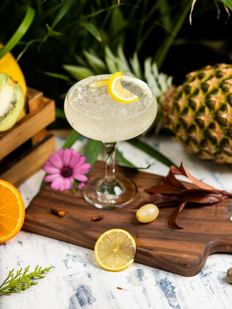 Refreshing summer alcoholic cocktail margarita with crushed ice and citrus fruits