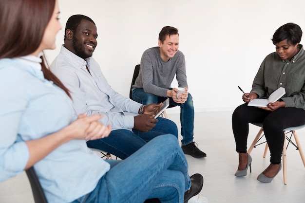 Rehab patients smiling and and talking to each other