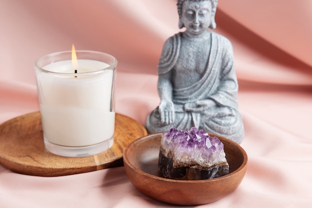 Reiki symbols concept with candle and crystal