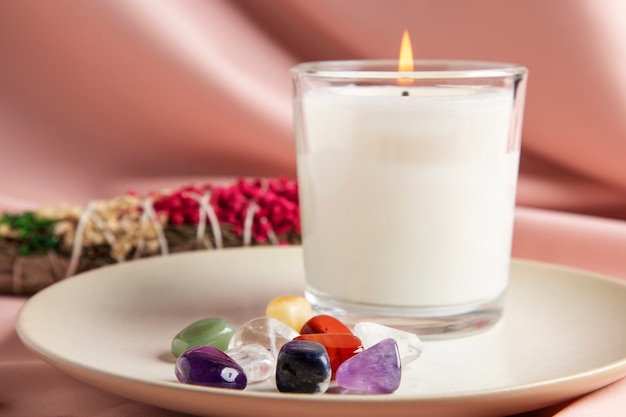 Reiki symbols concept with candle and stones