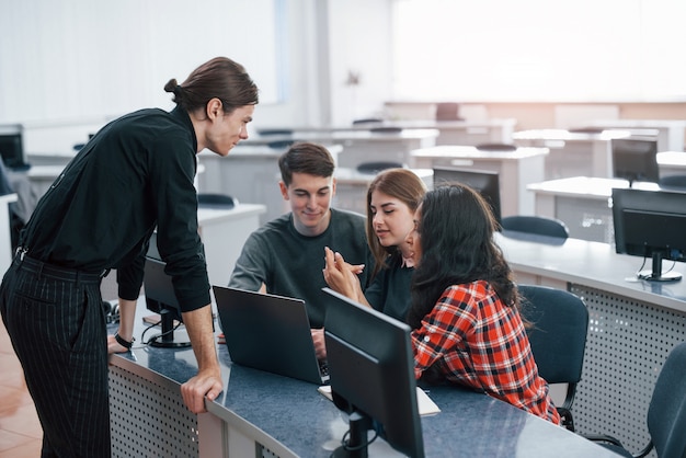 Free Photo don't relax. group of young people in casual clothes working in the modern office