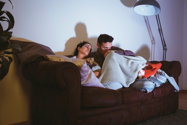 Relaxed couple watching a movie