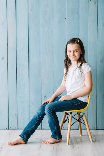 Relaxed girl sitting on chair