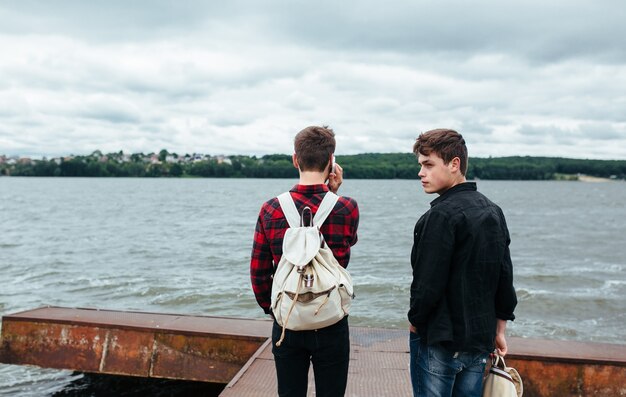 Relaxed guys on the pier