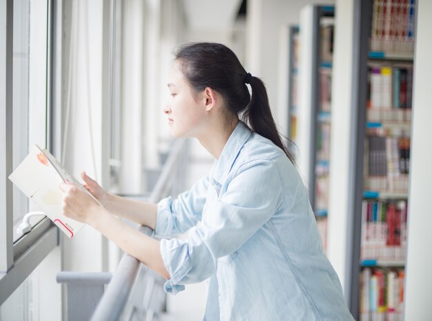 Relaxed student with a book