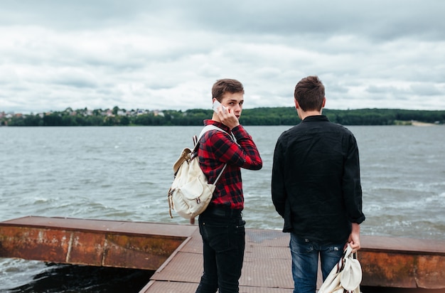 Relaxed teenagers spending the afternoon at the pier