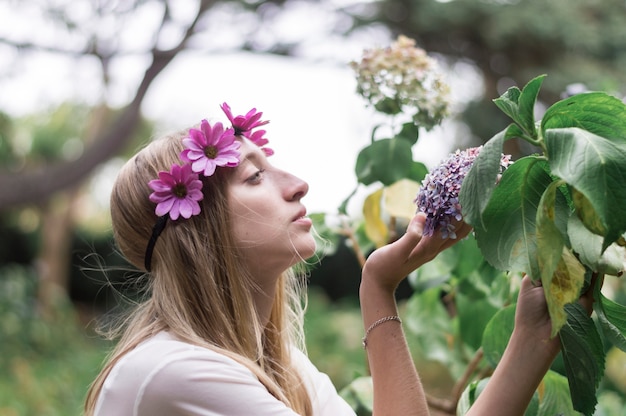 Relaxed woman holding a flower