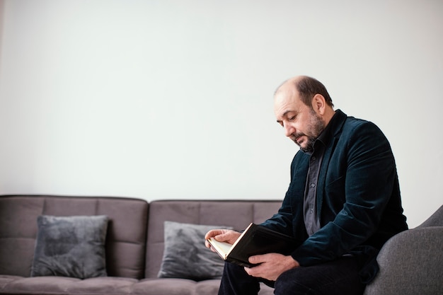 Religious man holding a holy book