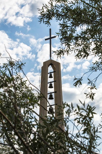 Free photo religious monument with cross and bells