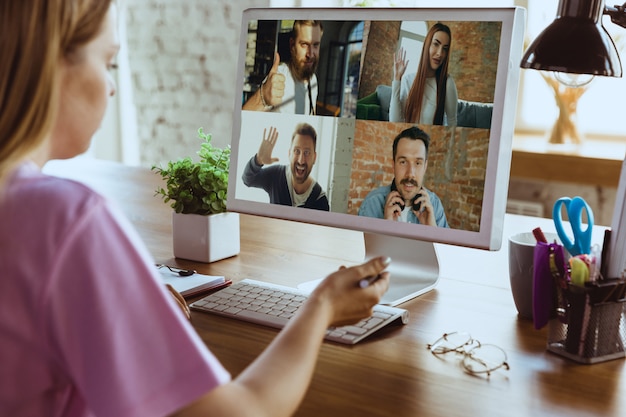 Free Photo remote meeting. woman working from home during coronavirus or covid-19 quarantine, remote office concept.