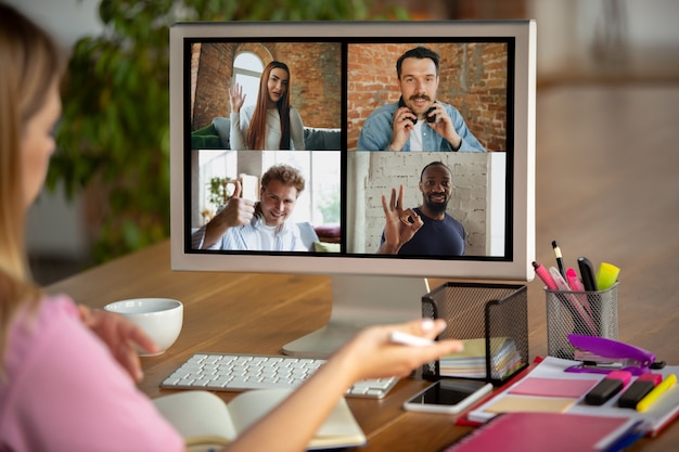 Free photo remote meeting. woman working from home during coronavirus or covid-19 quarantine, remote office concept.