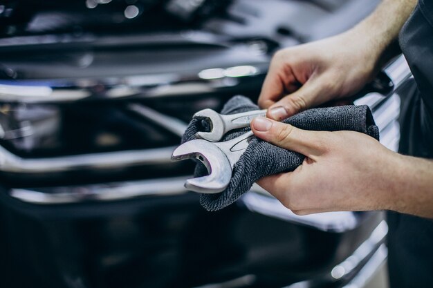 Repair man making car service