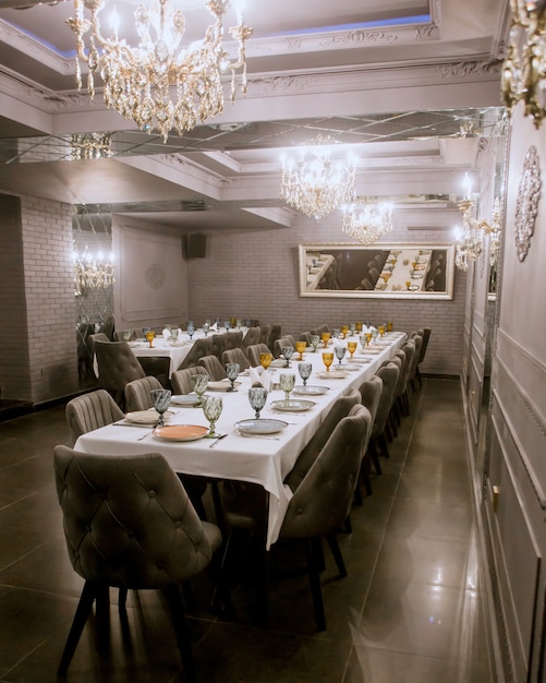 Restaurant room with two long dinner tables