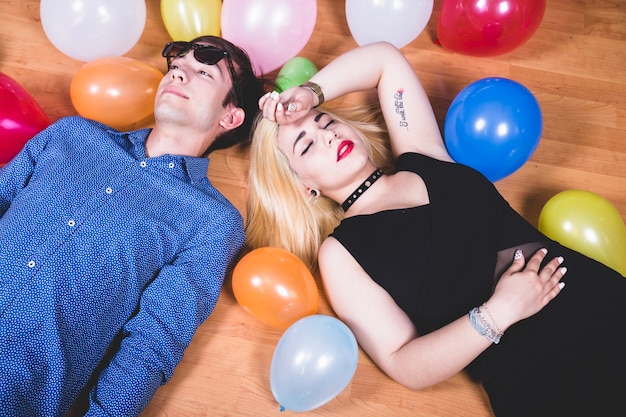 Resting with baloons on the floor