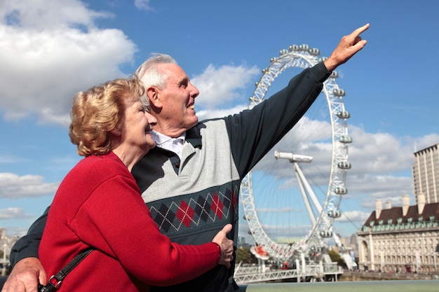 Retired couple in london with millenium wheel