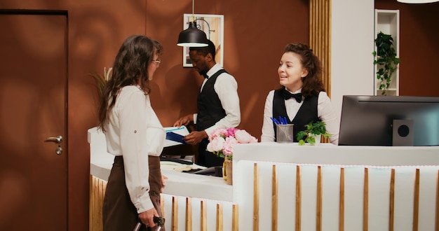 Free photo retired woman arriving at hotel resort