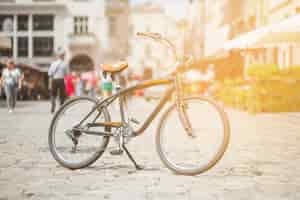 Free photo retro bicycle parked on street in city