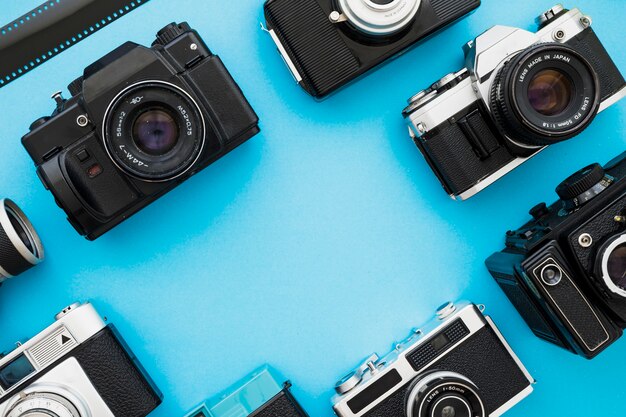 Retro cameras near piece of film