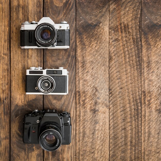 Retro cameras on wooden tabletop