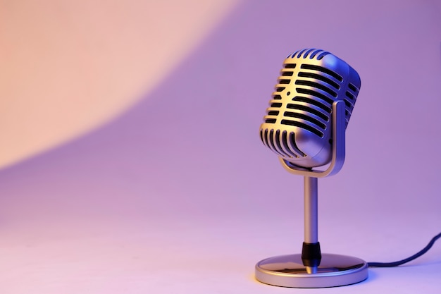 Free Photo retro microphone isolated on color background