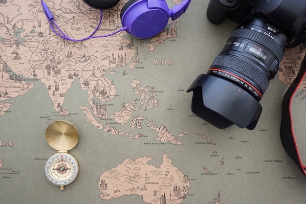 Free photo retro world map background with compass and camera