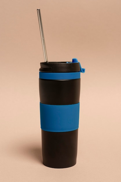 Free photo reusable thermos with straw