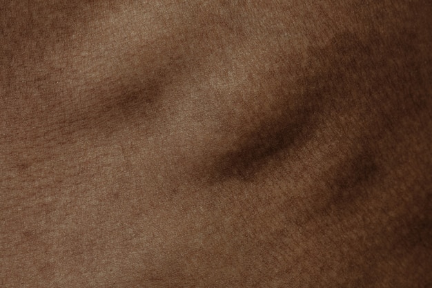 Ribs. Detailed texture of human skin. Close up shot of young african-american male body. Skincare, bodycare, healthcare, hygiene and medicine concept. Looks beauty and well-kept. Dermatology.