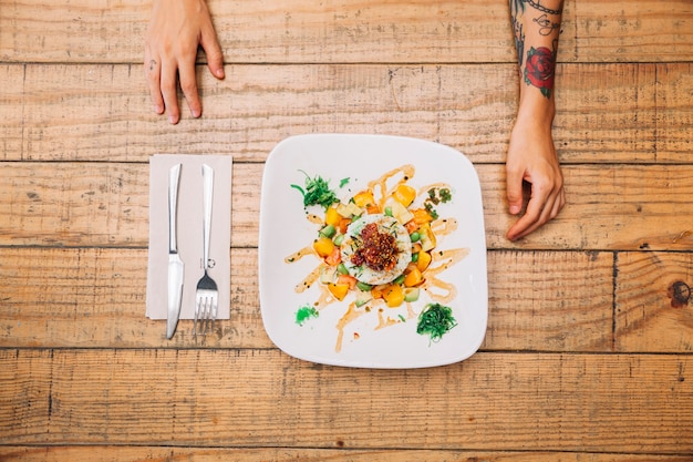 Rice dish and hands