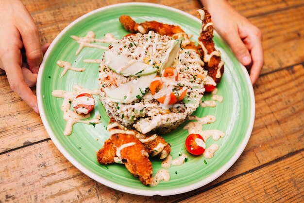 Rice dish and hands