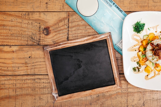 Free photo rice dish next to slate