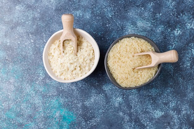 Rice flakes, rice noodles, rice bread and rice, top view