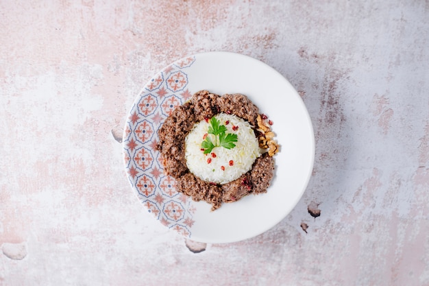 Free Photo rice garnish with meat balls in white plate.