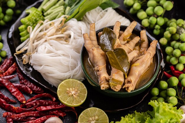 Rice noodle and Chicken feet liquid.