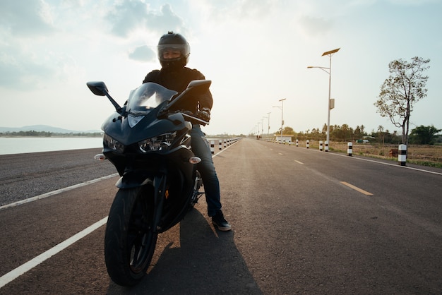 Rider Motorbike on the road riding. having fun driving the empty road