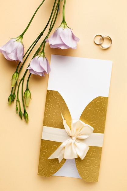 Free photo rings and flowers luxury wedding stationery