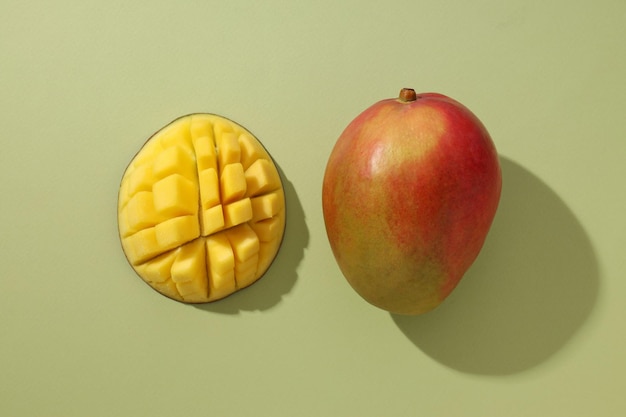 Ripe delicious mango on a light background