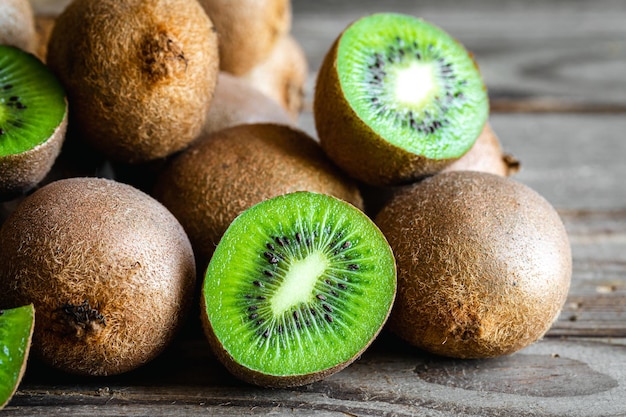 Free photo ripe fruits of kiwi cut and whole close up