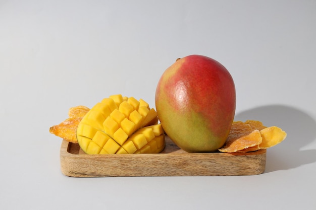 Free Photo ripe juicy mango on a wooden board