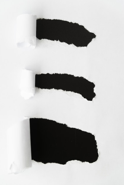 Free Photo ripped paper revealing black