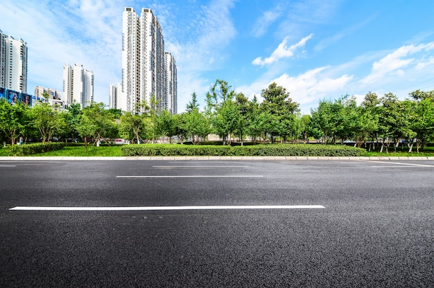 Road with a buildings and park background