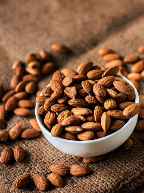 Roasted almonds in a white bowl