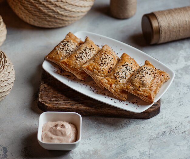 Roasted blinchik, russian crepes served with tartar sauce.