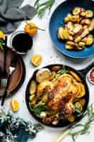 Free photo roasted chicken with potatoes holiday dinner food photography