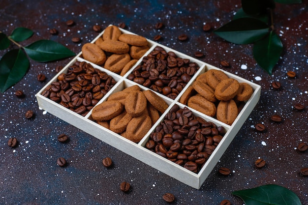 Free photo roasted coffee beans and coffee bean shaped cookies