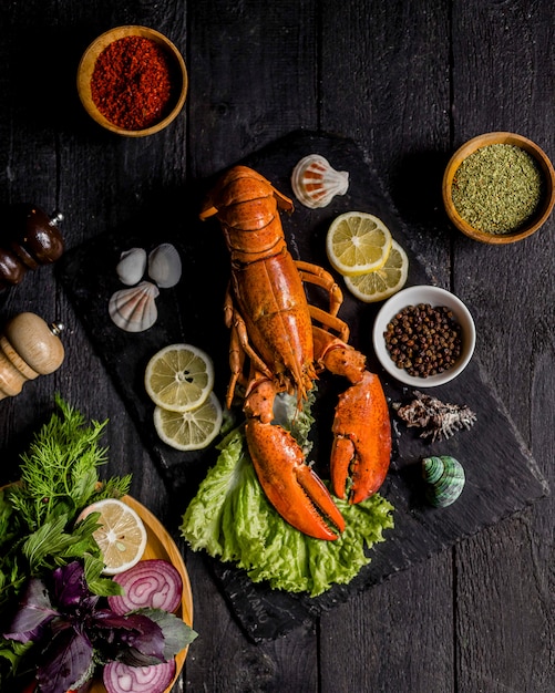 Roasted lobster served with vegetables and lemon