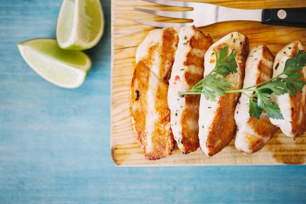 Free photo roasted meat decorated with parsley