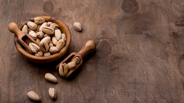 Roasted pistachio nuts on wooden table